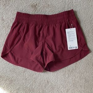 NWT Lululemon Tracker shorts in Chianti, size 10